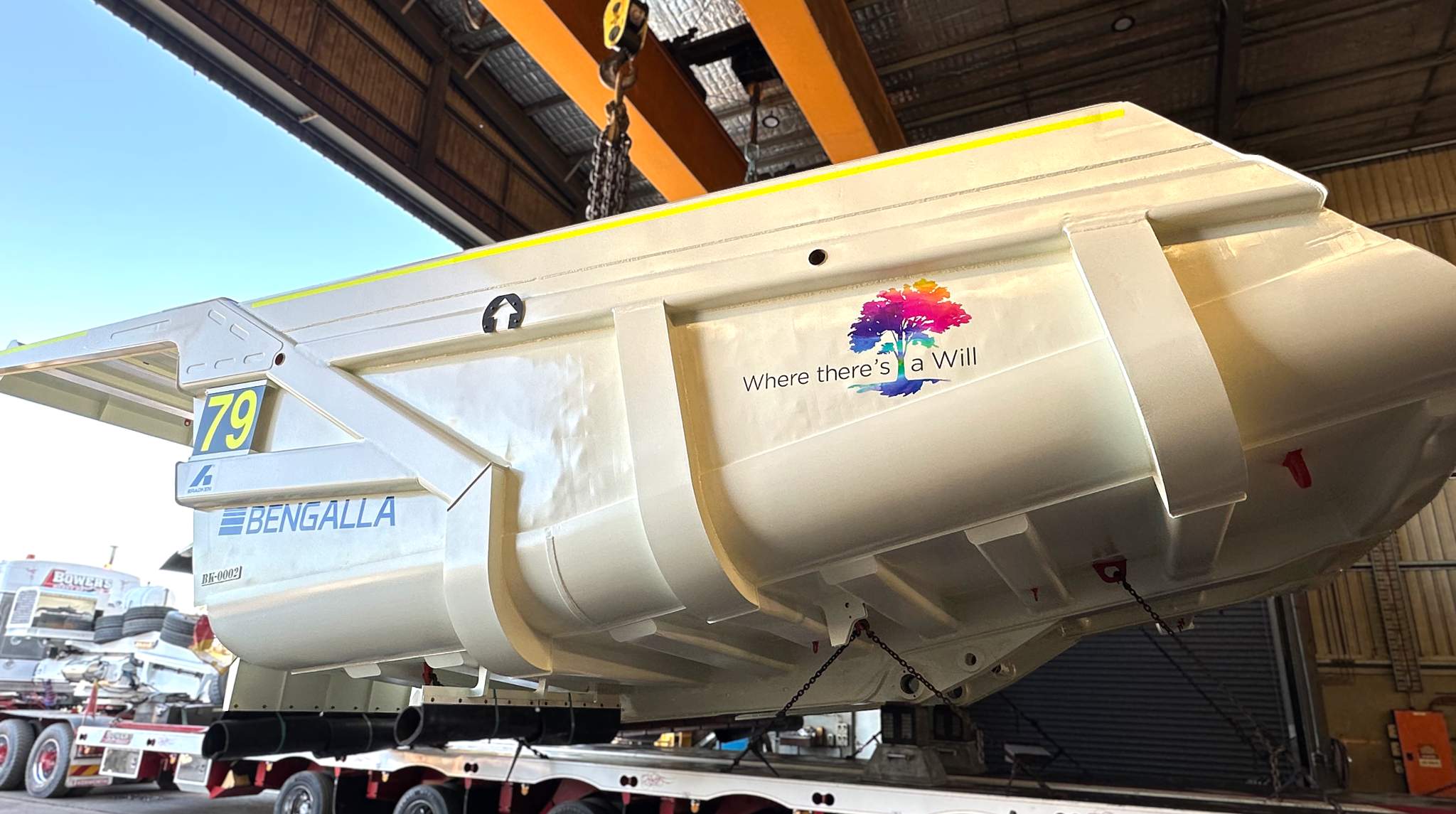 Mining truck tray painted white with decals for Bradken, Bengalla Mining Company and Upper Hunter Where There's a Will charity on it.